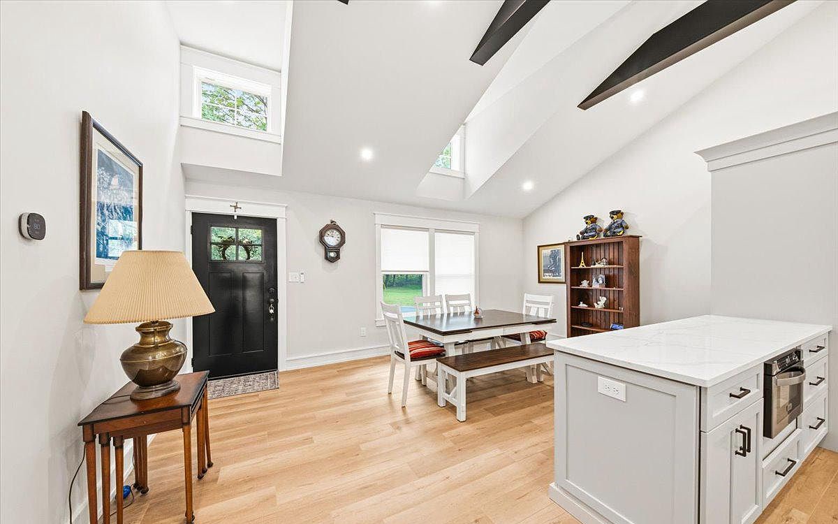 Open dining area under cathedral ceilings
